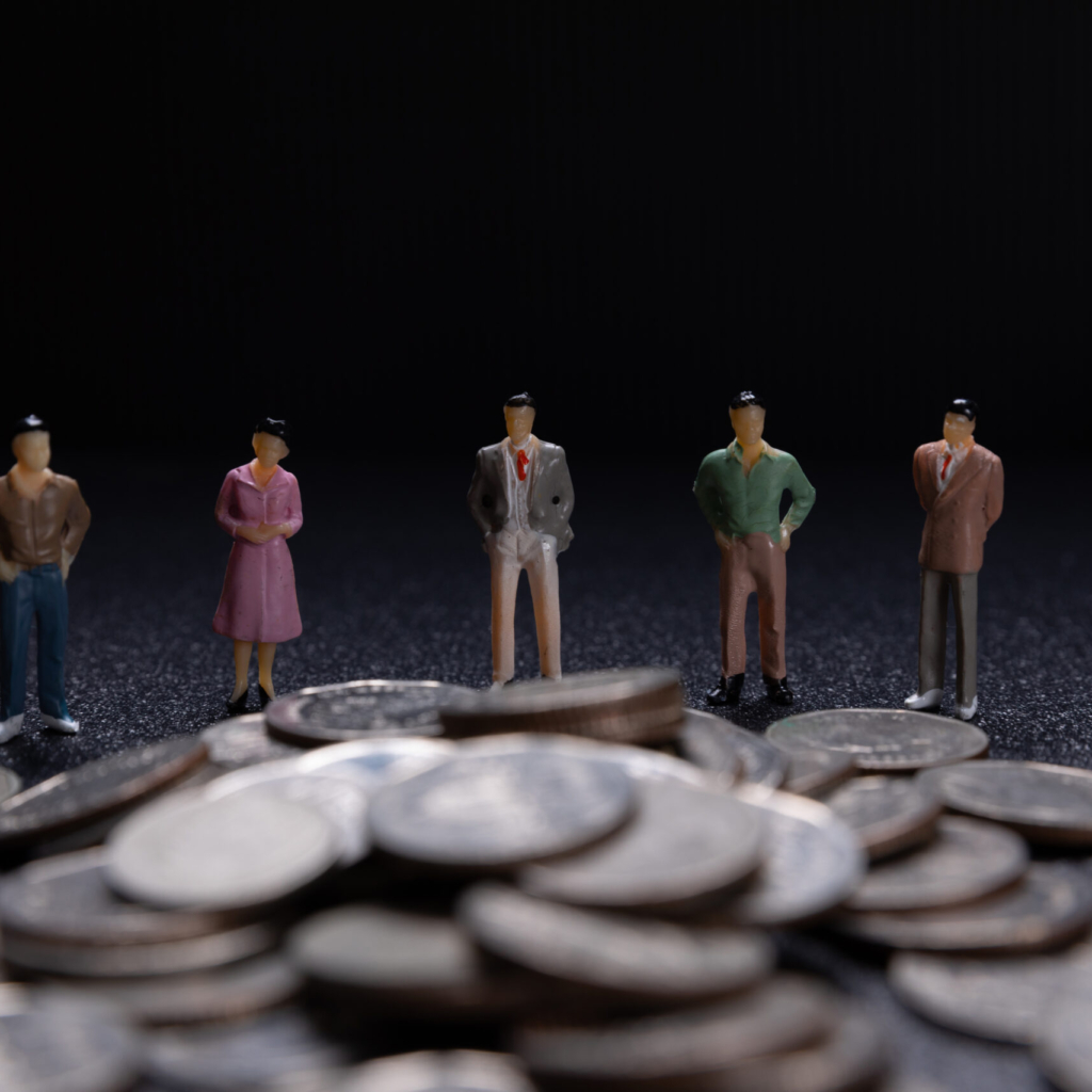 Miniature people: Group of small businessmen standing on coin with  Business Growth concept.