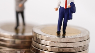 Business man miniature people stand on coin and calculator, management business finance concept.