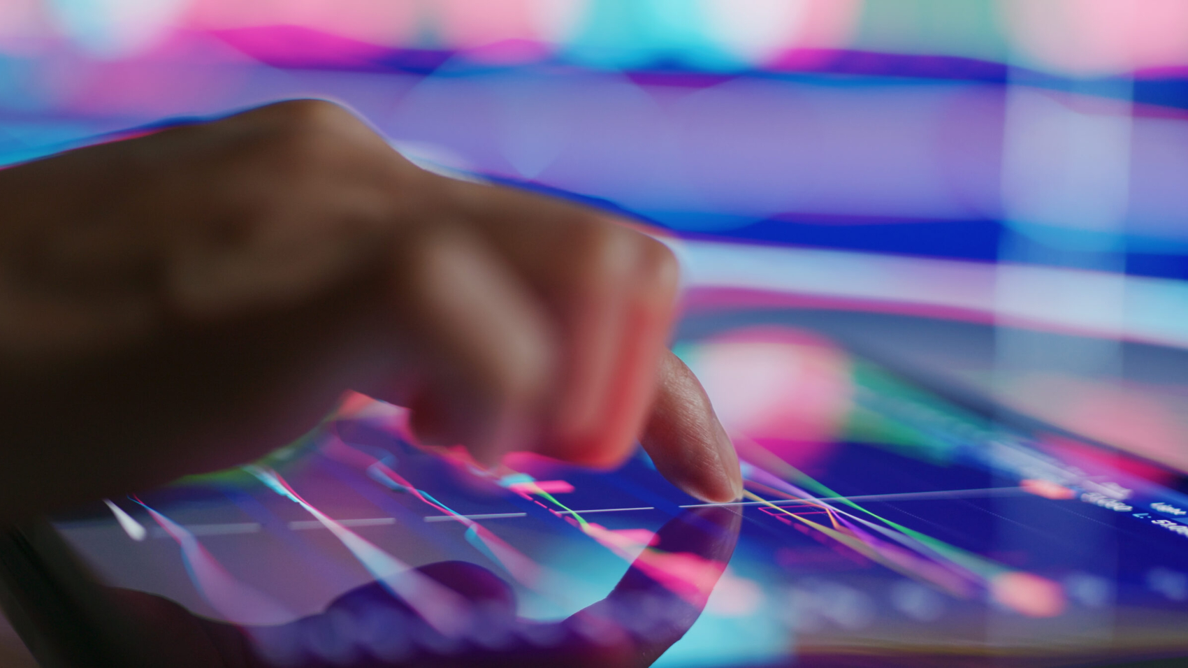 Touch on the tablet with stock market data graph