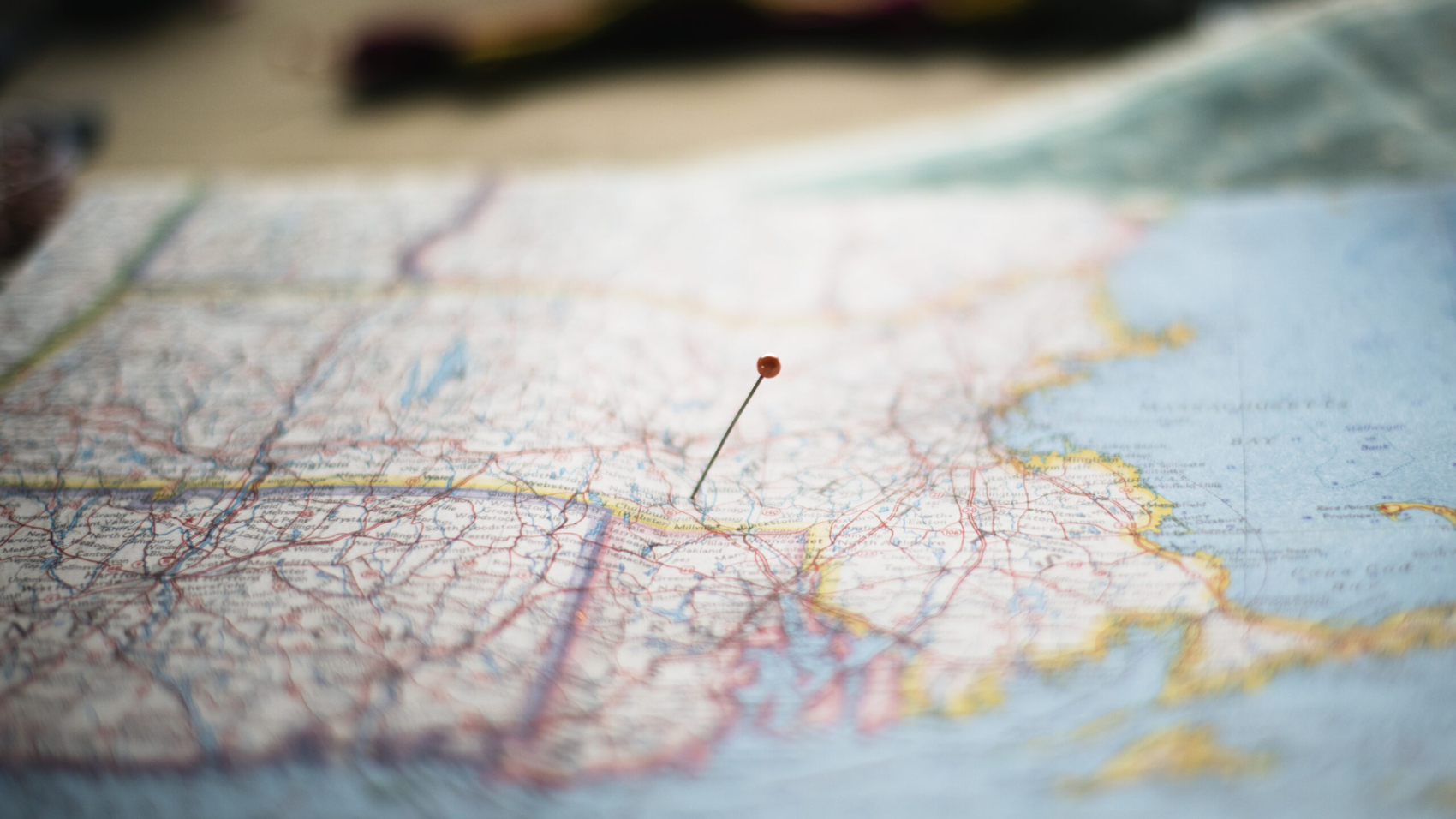 Closeup of pin on the map planning travel journey