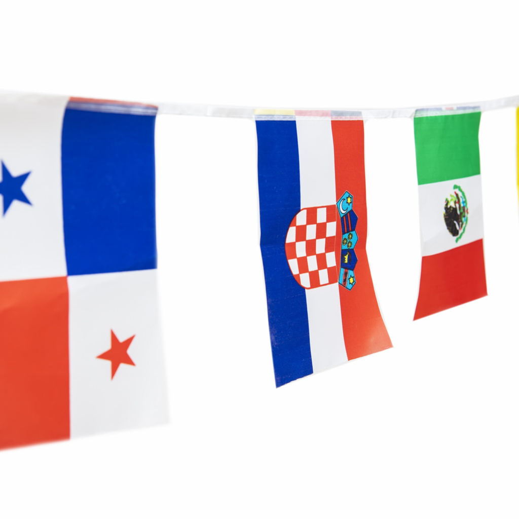 Triangle flags of various countries hanging on the rope, isolated on the white background