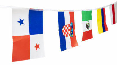 Triangle flags of various countries hanging on the rope, isolated on the white background